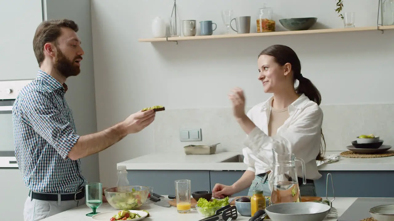 Pretty Woman Seasoning An Avocado Toast And Giving It To Her Husband