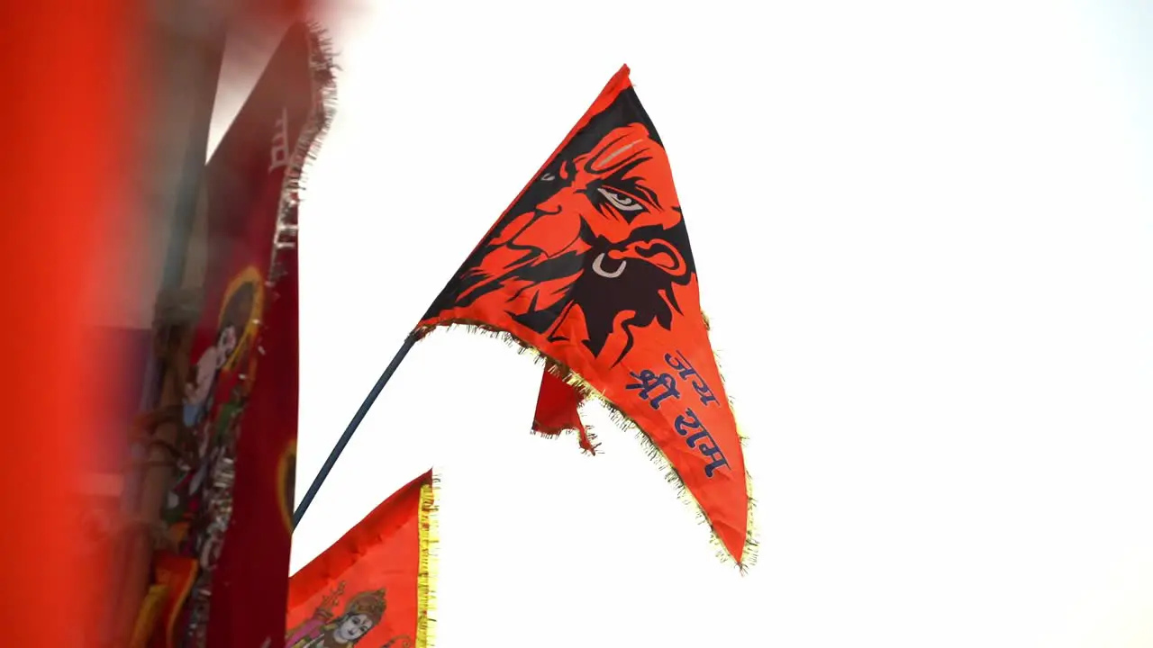 Orange color Flags with Lord Hanuman Face on it Depicting Santana Dharma and Hinduism Waving in Air at Ayodhya  Uttar Pradesh  India