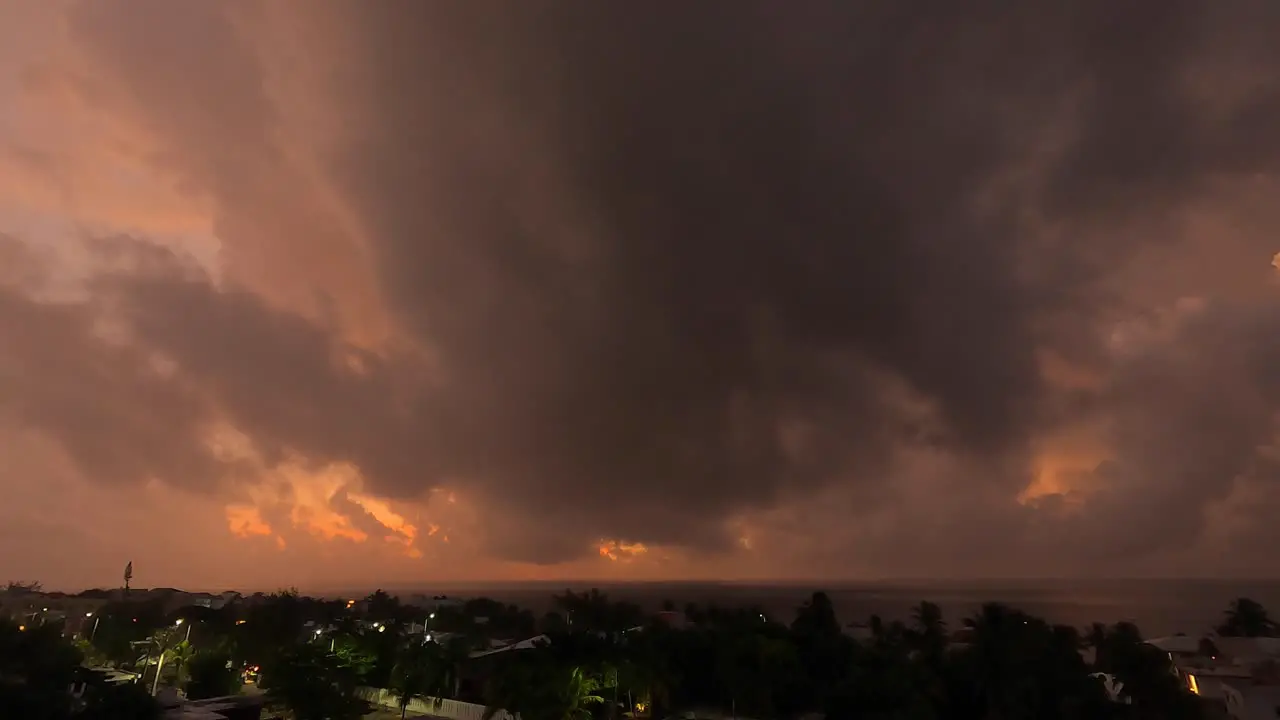 a new day a new dawn sun is rising above the orange clouds on this night to day time lapse over seeing the caribean sea