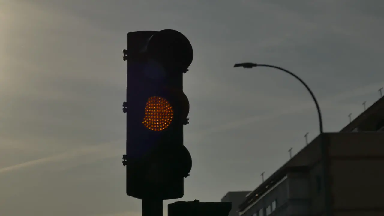 A slow flashing orange traffic light