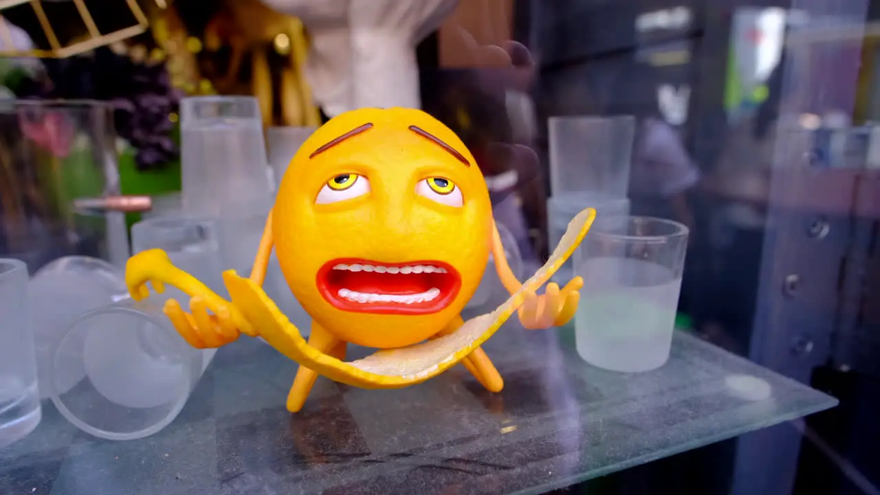 closeup of a funny orange with big eyes nose and lips