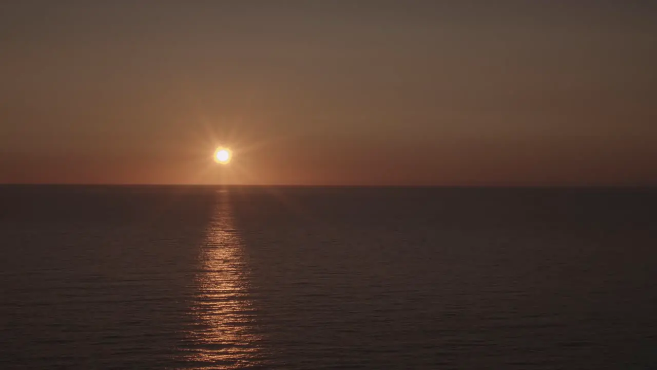 Time-lapse of sun setting over the sea at New Quay in Wales United Kingdom