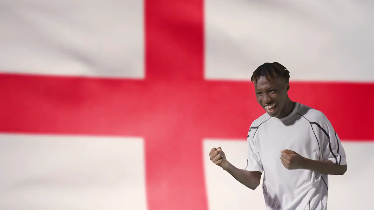 Young Footballer Celebrating to Camera In Front of England Flag 02