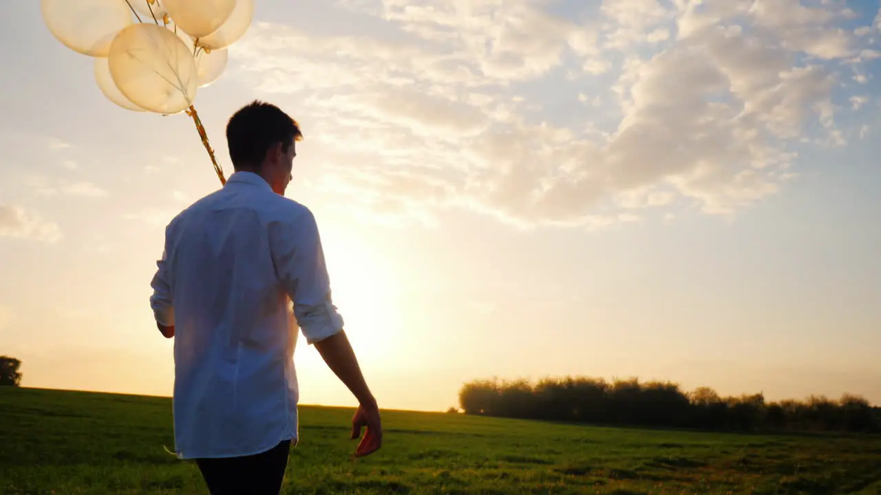 A Teenager In A White Smart Shirt With Balloons In His Hand