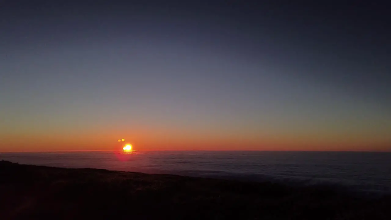 A time lapse of the sunset over a sea of clouds