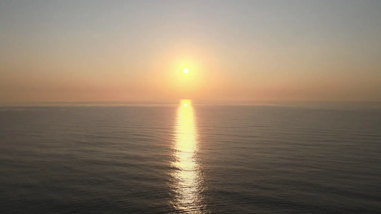 Aerial Drone Shot of a Beautiful Calm Sunrise Over the Gulf of Thailand with Reflection