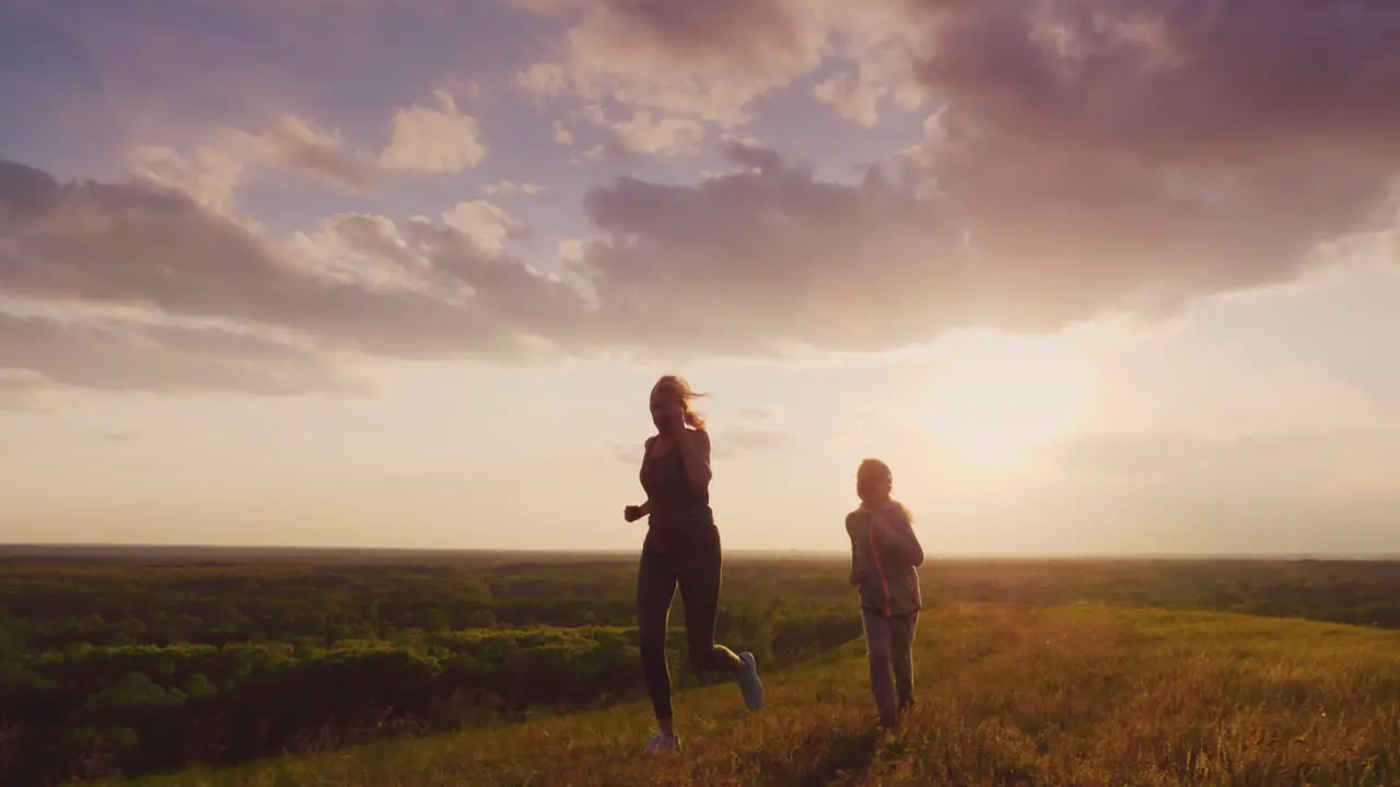 Mom And Daughter Are Racing In The Sunset