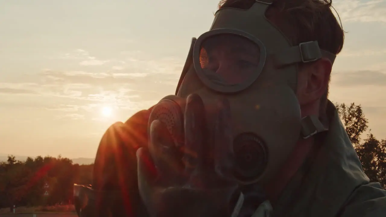 A young soldier in a chemical protective suit