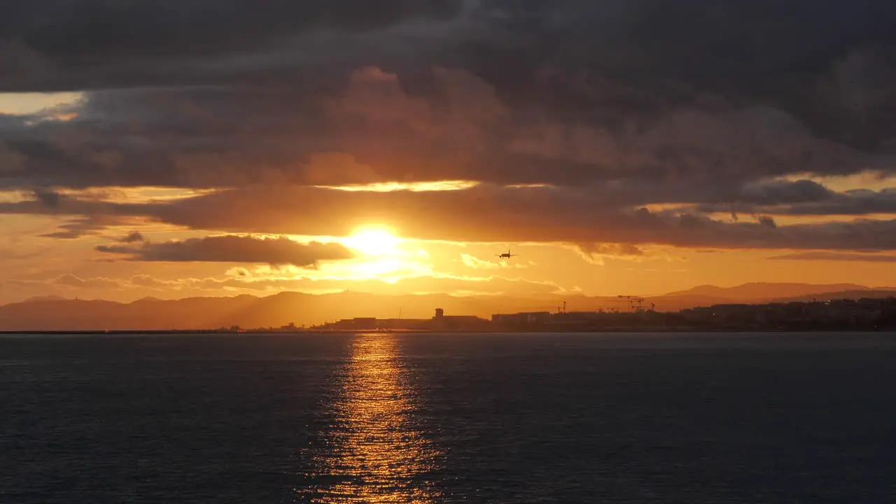 Airplane landing during stunning sunset Nice France Static