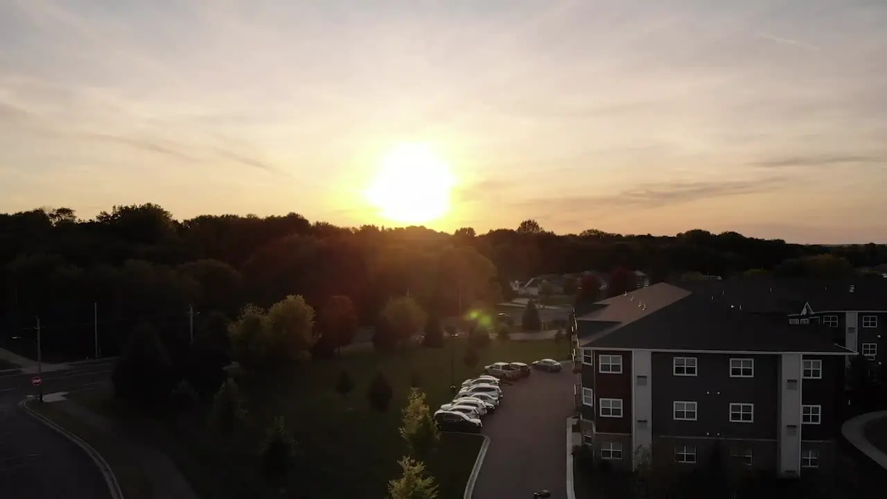 Backward moving aerial over the beautiful urban city of Shakopee Minnesota during golden hour