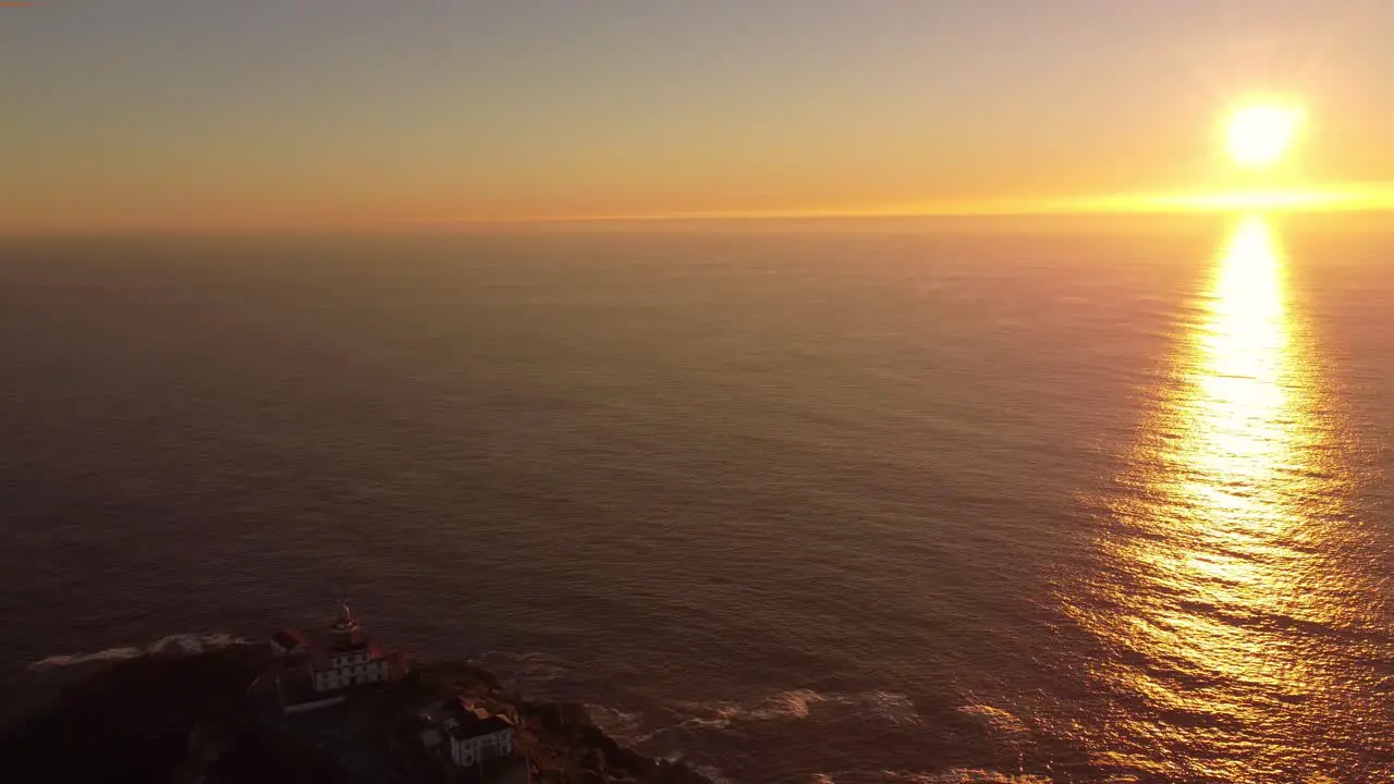 Aerial reveal cape finisterre fisterre rock formation famous for trekking to Santiago de Compostela drone footage sunset