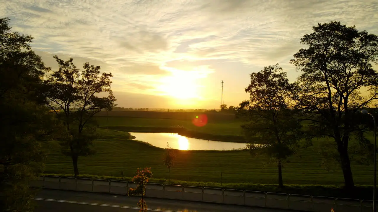 Cloudscape With Vibrant Sunlight Over Serene Meadow Landscape In Lubawa Poland Pullback Shot