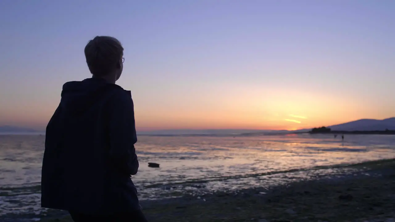 Teenager Taking Photo of Beach with Low Tide During the Sunset British Columbia