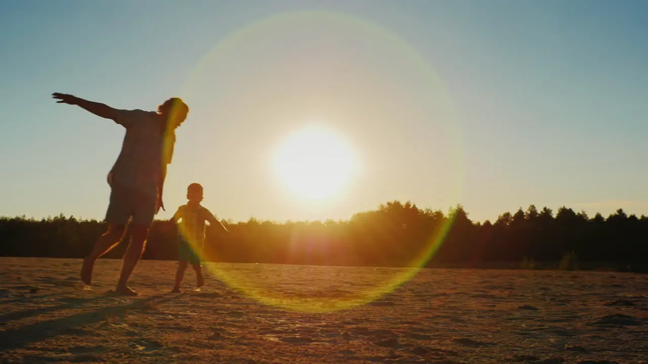 Healthy Father Playing With His Son At Sunset Depicts The Aircraft Then Circled Son