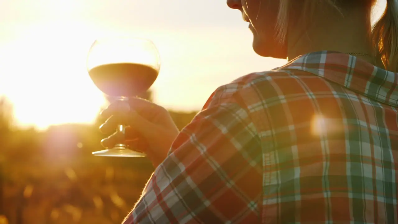 Woman With Red Wine at Sunset