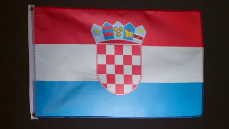 Studio Shot Of Flag Of Croatia Flying Against Black Background