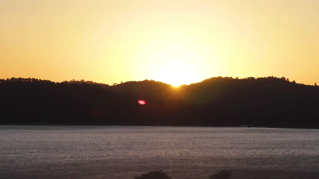 Time Lapse of the sun setting behind some mountains