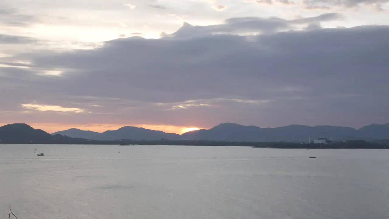 Beautiful sunset view over the mountain range over the sea bay of phuket island in summer daytime