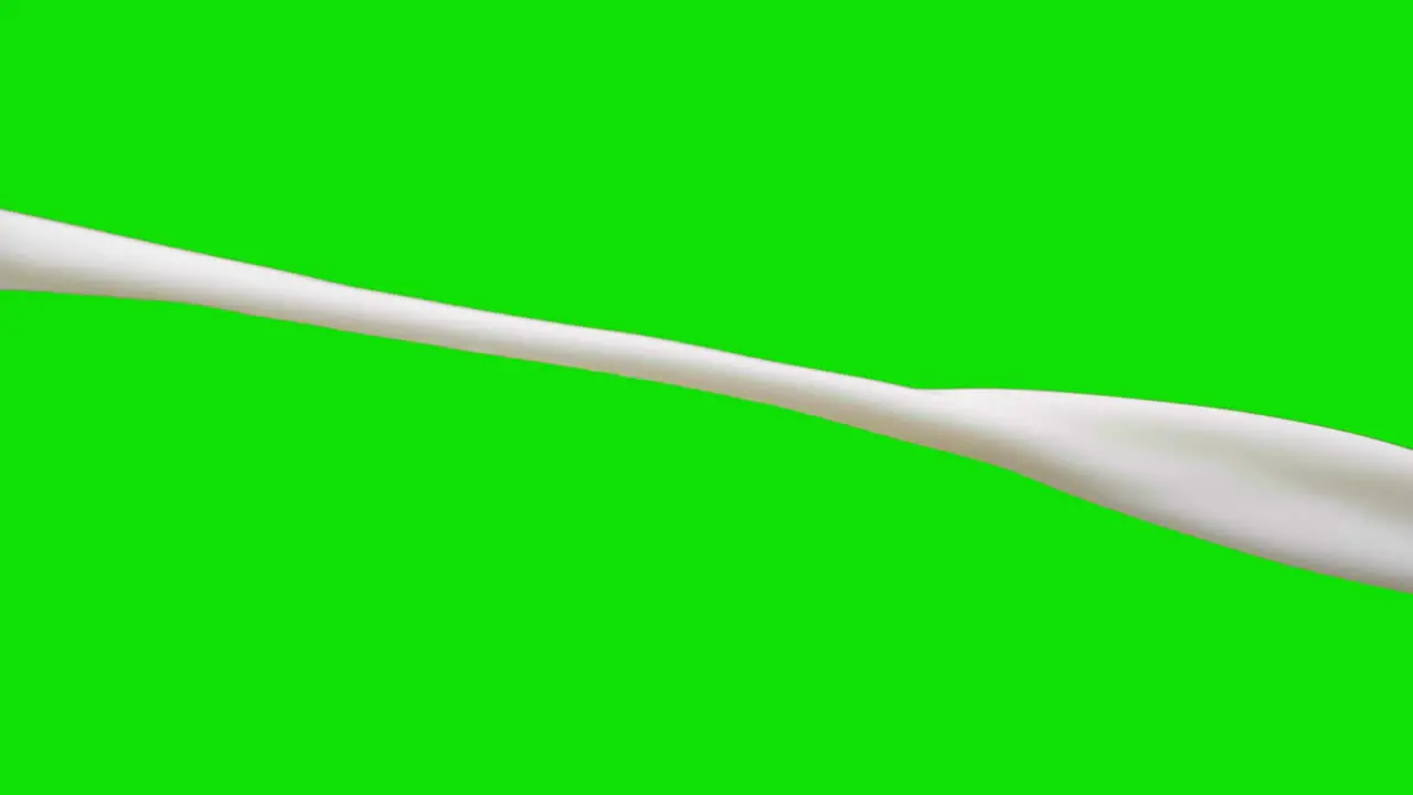 Static animation of vegan milk pouring with a green screen background for easy cropping