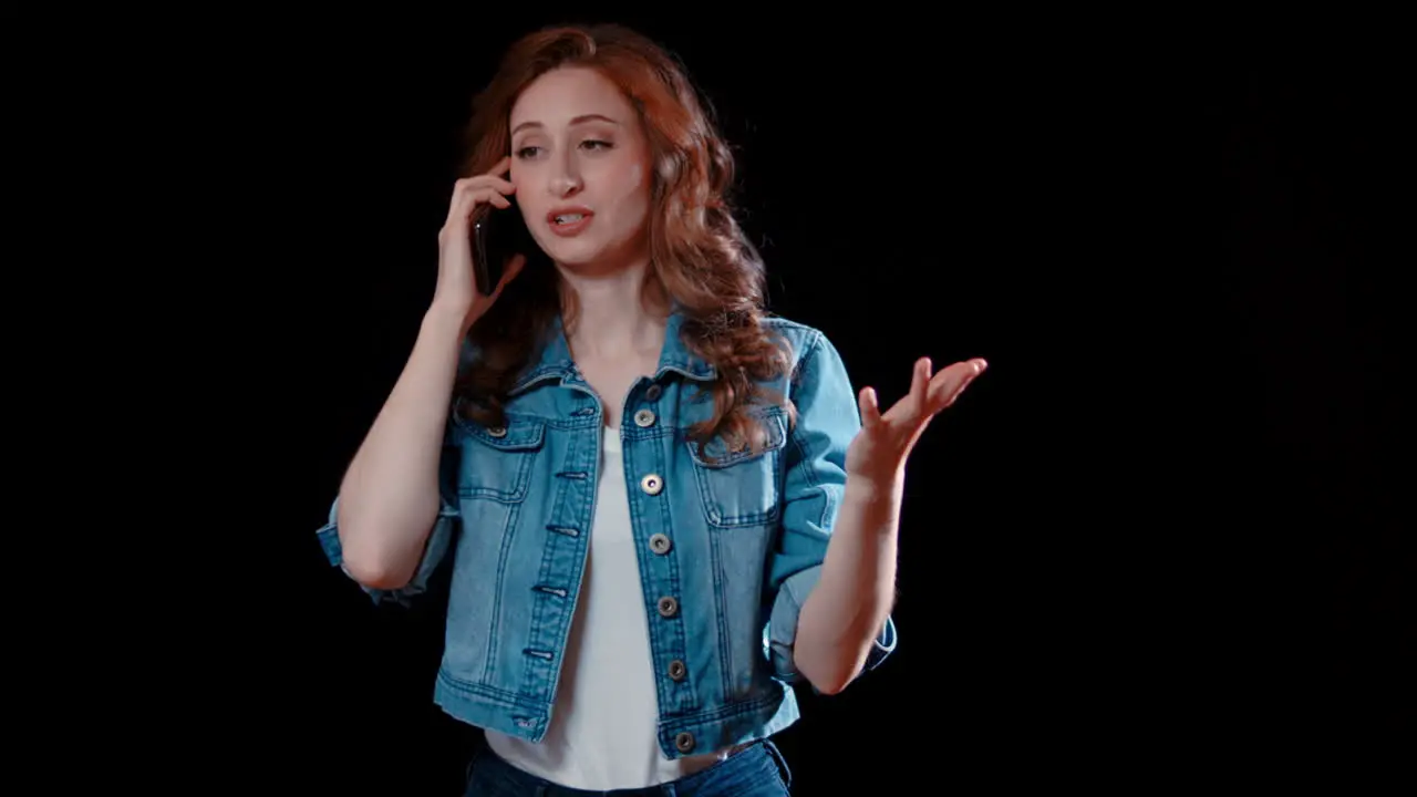  A young caucasian woman talks on the phone