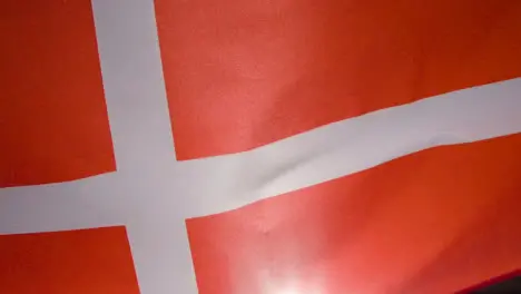 Close Up Studio Shot Of Danish Flag Flying Filling Frame