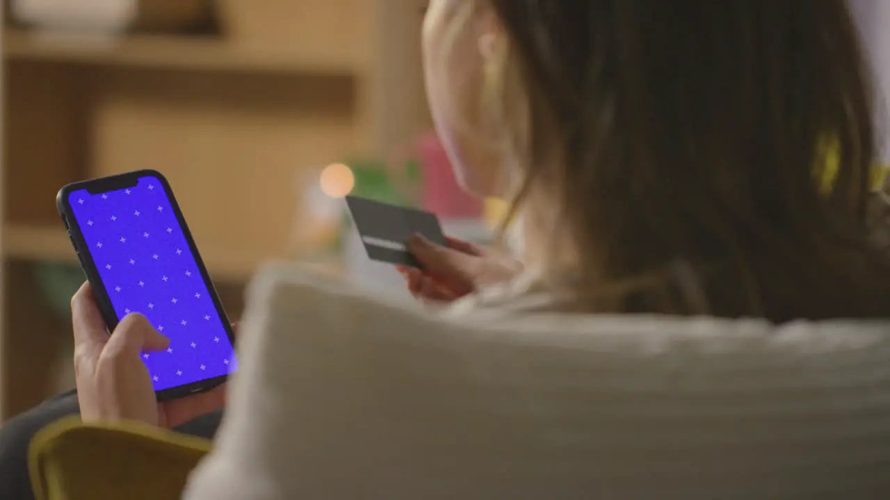 Close Up Of Woman At Home Shopping Online With Credit Card Using green screen blue Screen Mobile Phone 4