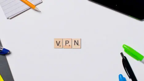 Stop Motion Business Concept Above Desk Wooden Letter Tiles Forming Acronym VPN