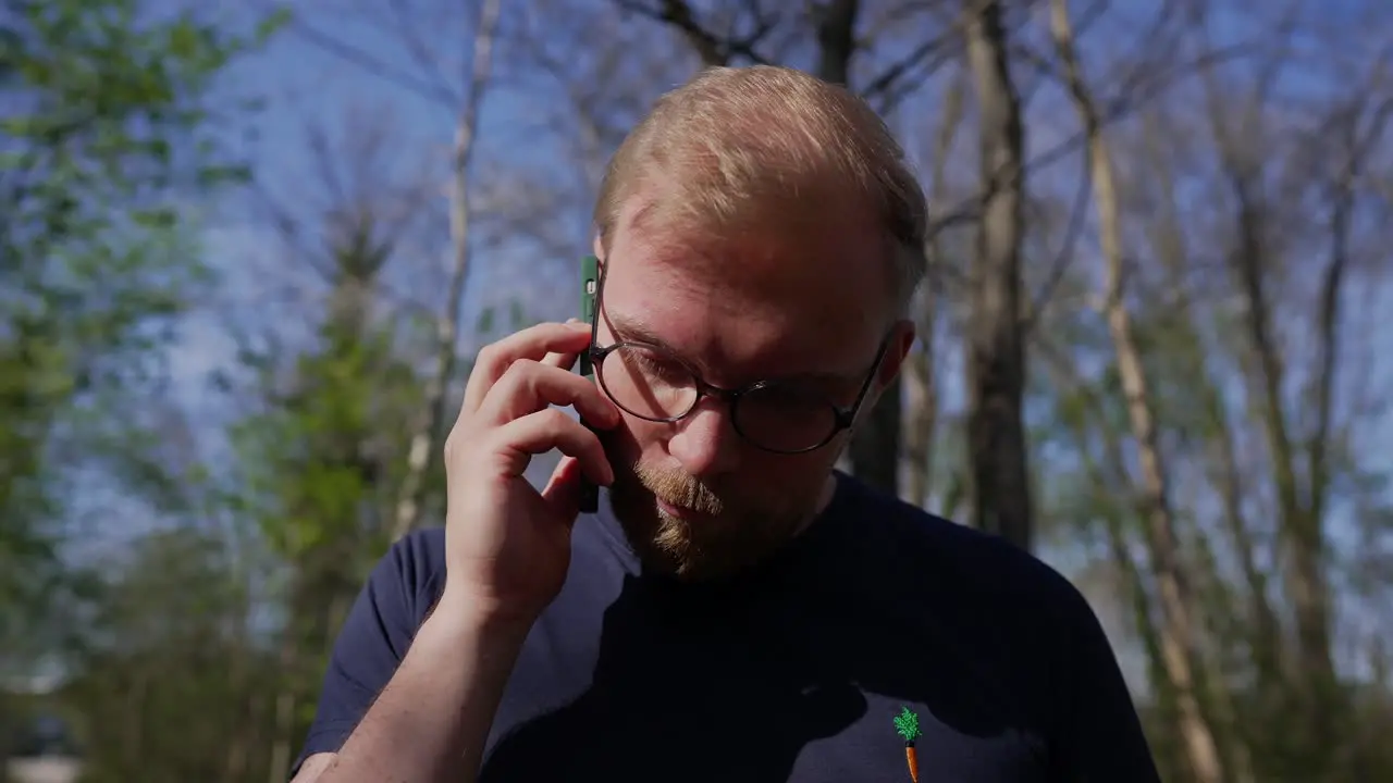 Man Having a Disappointing Business Call on Mobile Phone Close Up