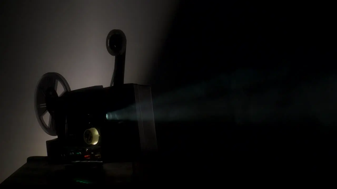 Super-8 film projector in a smoky room