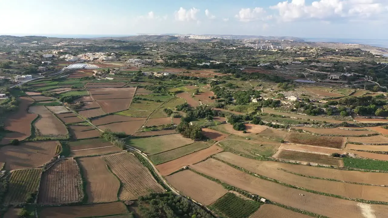 Drone shot in Malta flying above Bidnija fields