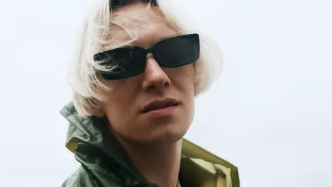 Blond man with sunglasses outdoors