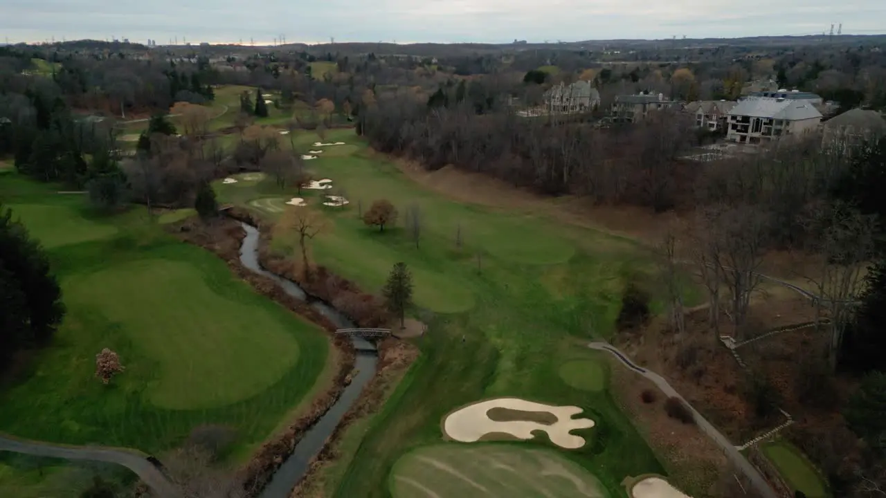 Aerial drone establishing shot of an empty green golf course in Toronto Ontario Canada