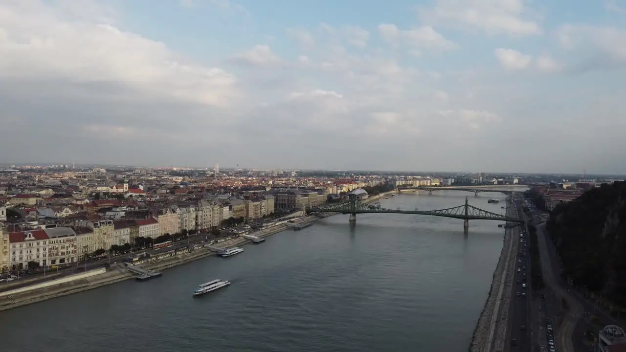 Danubio river all across Budapest city on a dull sunset over the Bridge