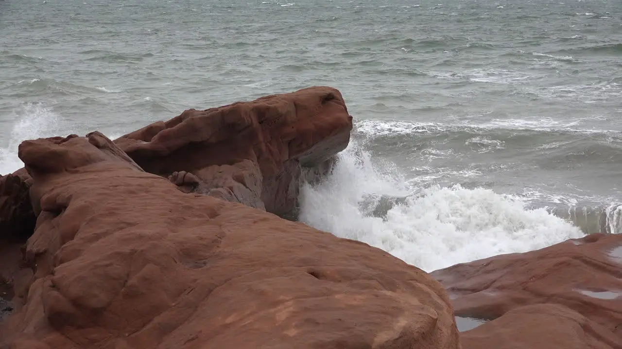 Canada Bay Of Fundy Waves On Red Rocks