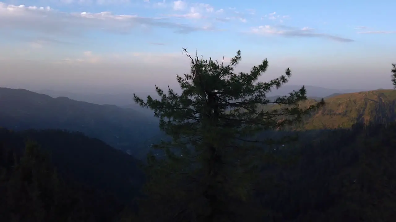 Sunrise on the top of the mountain looking to the valley at the bottom