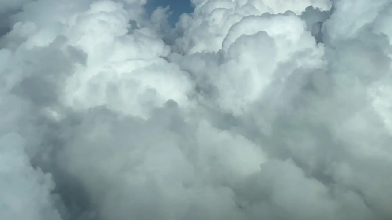 Flying trough withe clouds in a blue sky