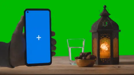 Wide Shot of Lantern Dates and Water with Green Screen and Blue Screen Phone