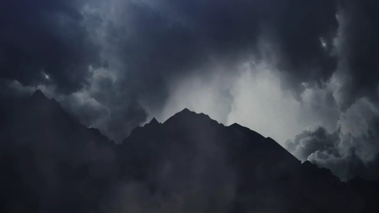 silhouette mountains and dark clouds and thunderstorms