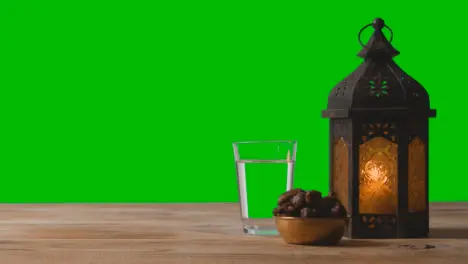 Wide Shot of Lantern Dates and Water In Front of Green Screen