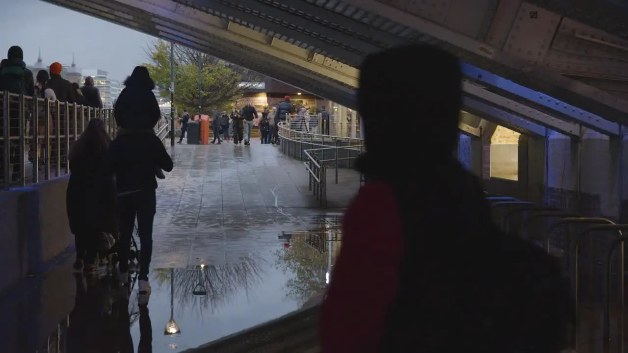 Rainy Pedestrian Underpass On London's South Bank With People