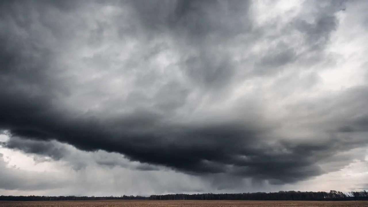 Dark stormy clouds above the fields