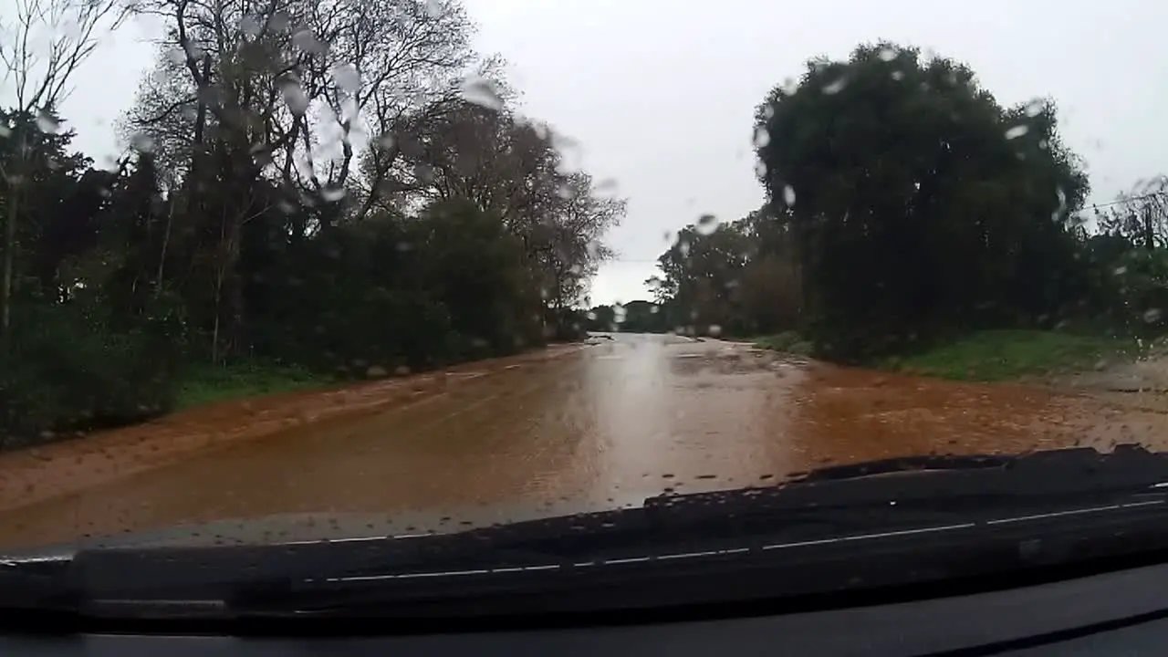 From a car driving through flooded roads in a rural Spanish village