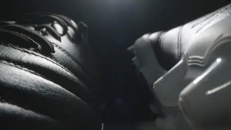 Studio Still Life Shot Of Football Soccer Boots Against Black Background 9