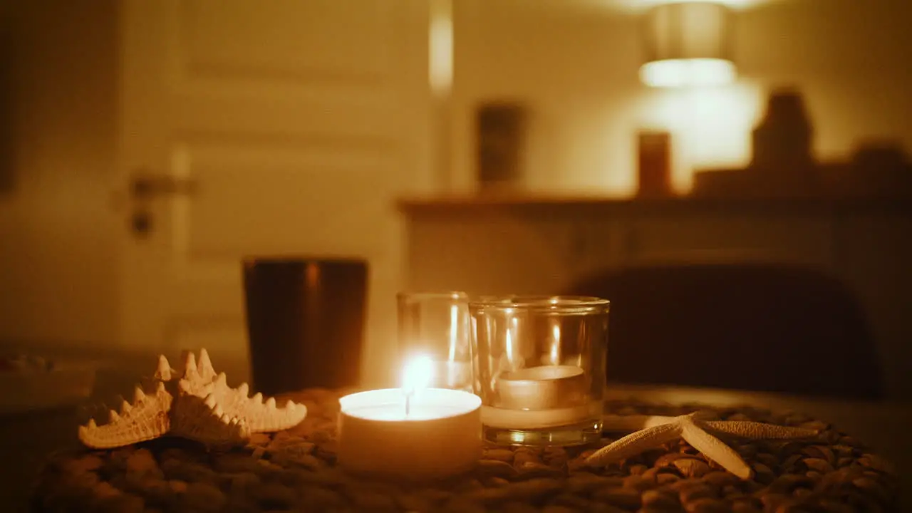 Romantic evening atmosphere with candle light in Scandinavian cottage room Nordic decor idea