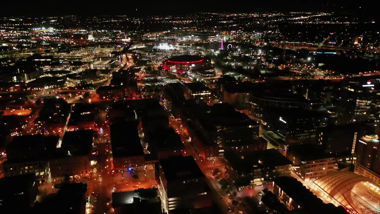 Aerial tilt shot of the Ball arena and the Union station of Denver night in Colorado USA