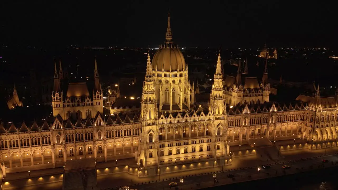 Aerial Boom Shot Above Hungary Parliament Building Night