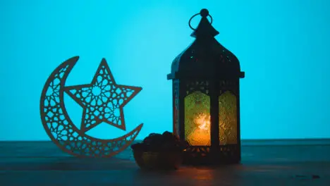 Tracking Shot of a Lantern Dates On Table During Dusk Ramadan Celebrations