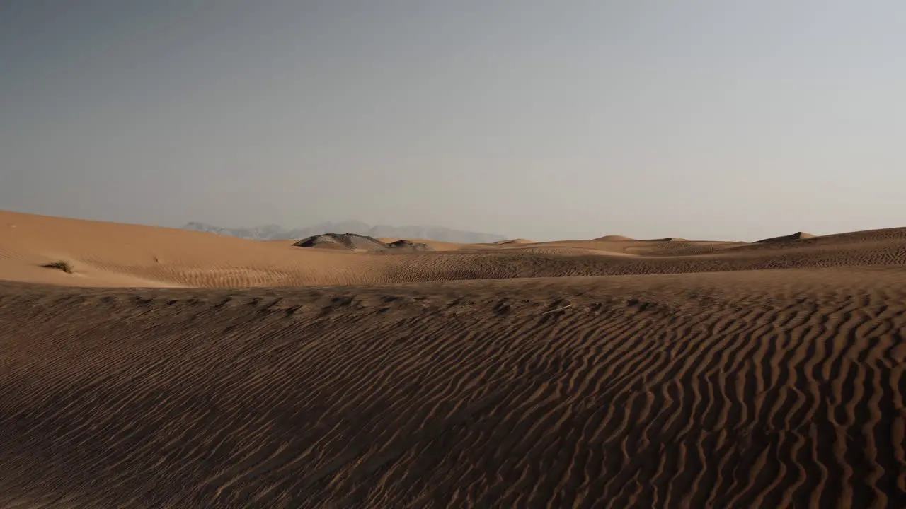 Middle eastern desert landscape near Dubai in the United Arab Emirates with distant mountains