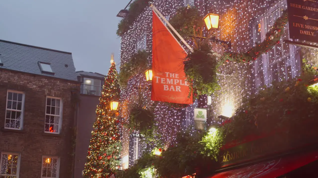 Temple Bar entrance sign decorated with christmas lights during nighttime