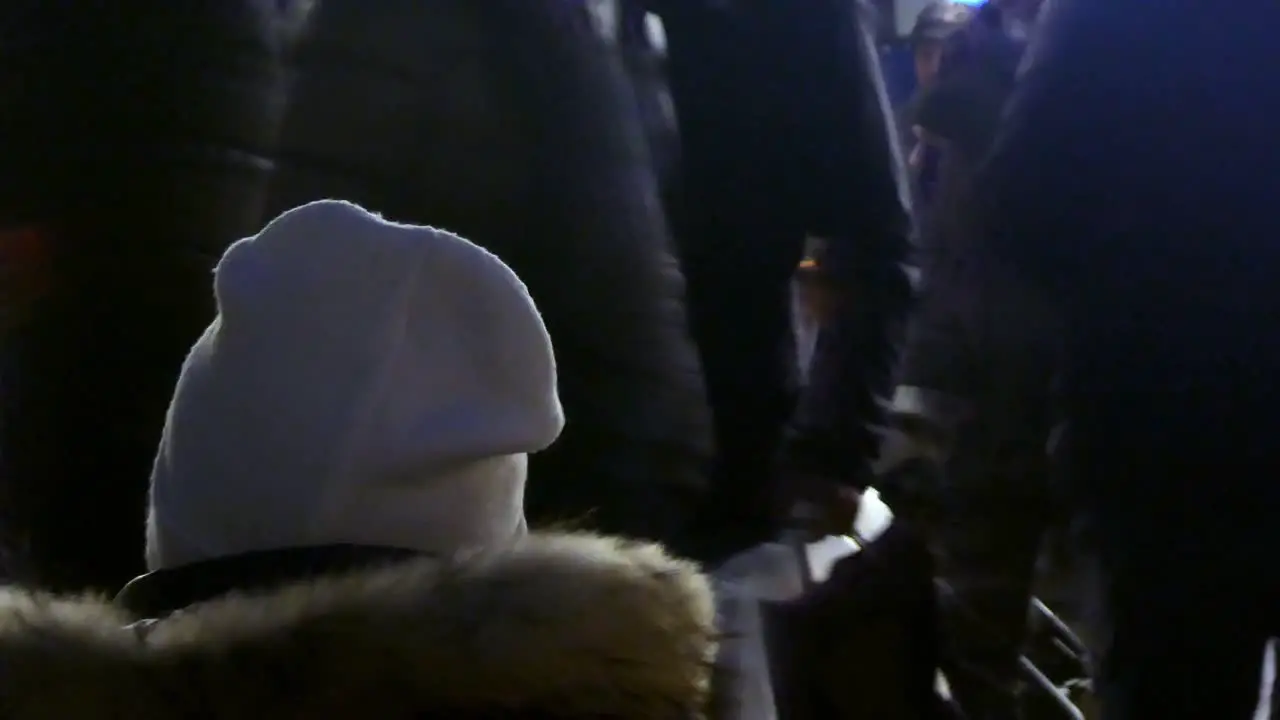 People gathered at Liverpool Christmas market sitting at bar area outdoor market stall